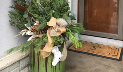 Seasonal Pot with ice skate and pine cones